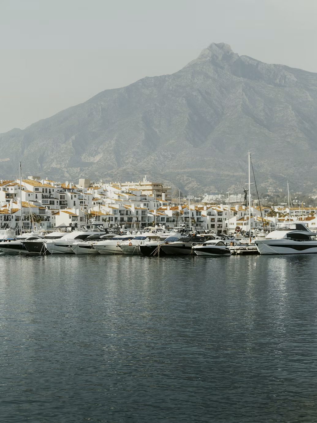 Yachts in the Puerto Banús marina with La Concha mountain behind